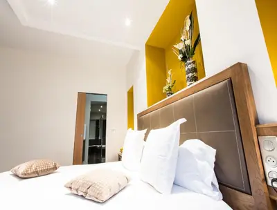 Un ou plusieurs lits dans un hébergement de l'établissement Hôtel Spa Marotte