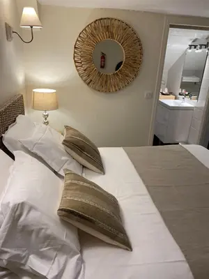 Un ou plusieurs lits dans un hébergement de l'établissement Hotel l'Avenue
