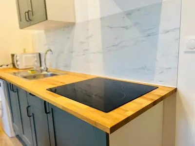 Cuisine ou kitchenette dans l'établissement Cosy Immo Key - Chambly Persan Roissy