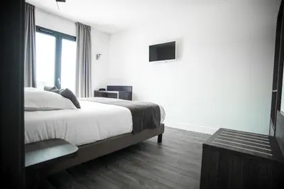Un ou plusieurs lits dans un hébergement de l'établissement Hotel Les Galets