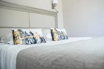 Un ou plusieurs lits dans un hébergement de l'établissement Hotel Les Galets