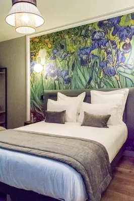 Un ou plusieurs lits dans un hébergement de l'établissement Hotel des Iris