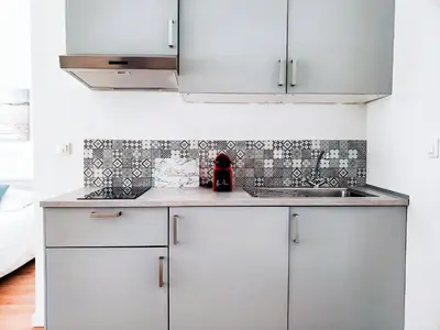 Cuisine ou kitchenette dans l'établissement Appart Rouen Centre
