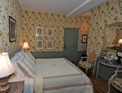 Un ou plusieurs lits dans un hébergement de l'établissement Château de Maudetour