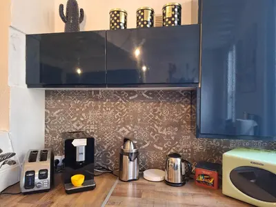 Cuisine ou kitchenette dans l'établissement Maison hypercentre Rouen avec parking gratuit
