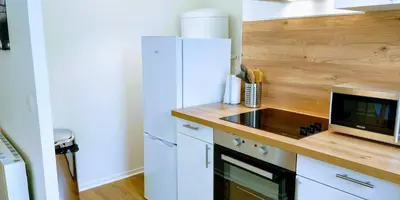 Cuisine ou kitchenette dans l'établissement Appart'HomeCity - Rouen Grand Voile