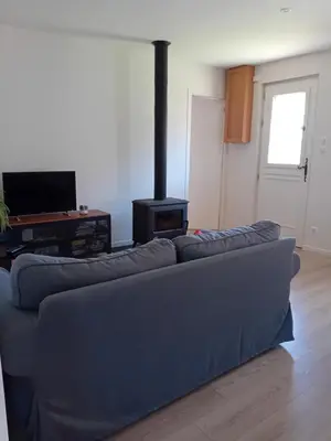 Coin salon dans l'établissement Gite Le Chat Huant