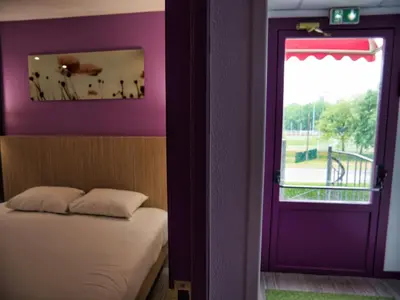 Un ou plusieurs lits dans un hébergement de l'établissement Contact Hotel Le Seino Marin - Cléon Elbeuf Rouen