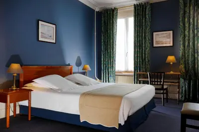 Un ou plusieurs lits dans un hébergement de l'établissement Grand Hotel de L'Univers