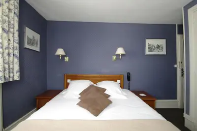 Un ou plusieurs lits dans un hébergement de l'établissement Grand Hotel de L'Univers