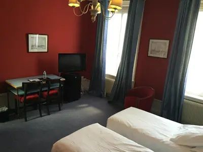 Un ou plusieurs lits dans un hébergement de l'établissement Grand Hotel de L'Univers