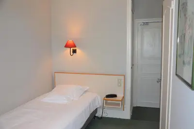 Un ou plusieurs lits dans un hébergement de l'établissement Grand Hotel de L'Univers