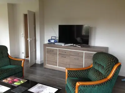 Télévision ou salle de divertissement dans l'établissement Maison de Charme en Normandie