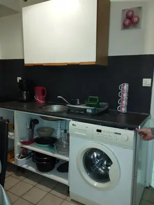 Cuisine ou kitchenette dans l'établissement Douce Brise