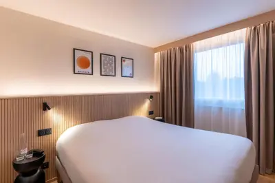 Un ou plusieurs lits dans un hébergement de l'établissement Grand Hôtel De La Seine