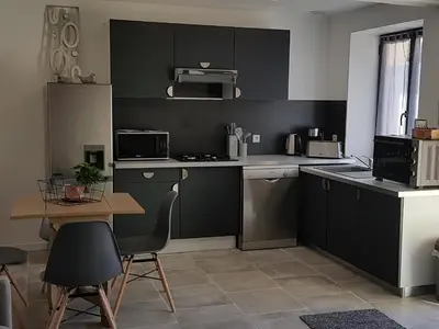 Cuisine ou kitchenette dans l'établissement L'Abaca 25