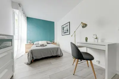 Un ou plusieurs lits dans un hébergement de l'établissement Le paradis de Lila