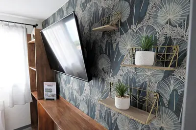 Télévision ou salle de divertissement dans l'établissement Eco-Appart'hôtel Rouen - JDP