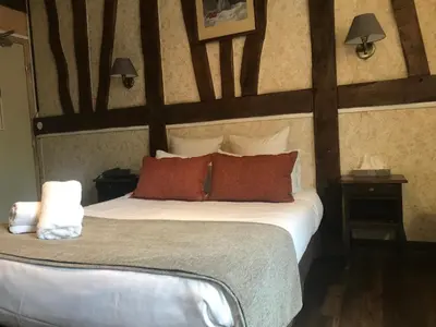 Un ou plusieurs lits dans un hébergement de l'établissement Hotel Morand