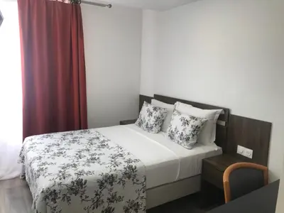 Un ou plusieurs lits dans un hébergement de l'établissement Hotel Morand