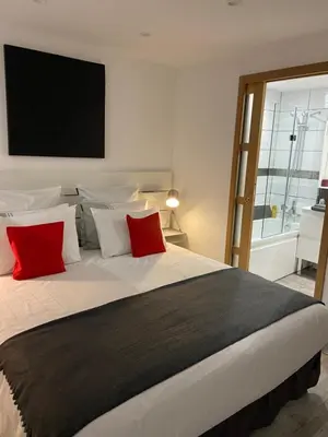 Un ou plusieurs lits dans un hébergement de l'établissement Charmant studio neuf de 40m2 / tout confort