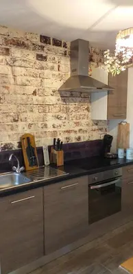 Cuisine ou kitchenette dans l'établissement la grange