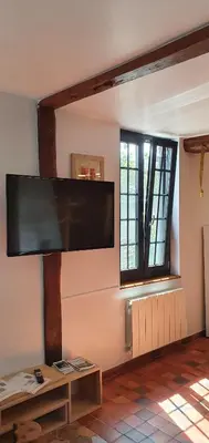 Télévision ou salle de divertissement dans l'établissement Gite à la ferme