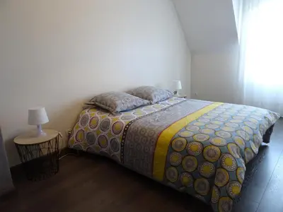 Un ou plusieurs lits dans un hébergement de l'établissement Duplex residence d'orléans