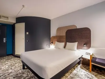 Un ou plusieurs lits dans un hébergement de l'établissement B&B HOTEL Rouen Centre Rive Droite