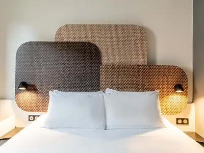Un ou plusieurs lits dans un hébergement de l'établissement B&B HOTEL Rouen Centre Rive Droite
