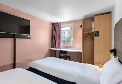Un ou plusieurs lits dans un hébergement de l'établissement B&B HOTEL Rouen Centre Rive Droite