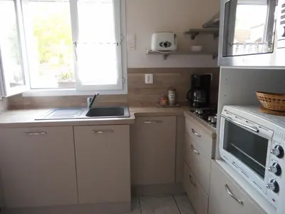 Cuisine ou kitchenette dans l'établissement Holiday Home Folleville near Asterix Park