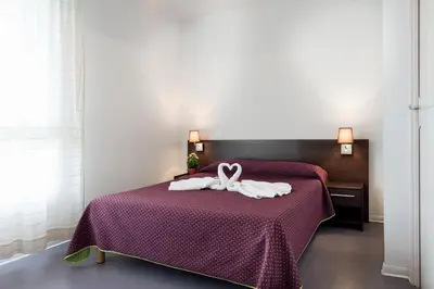 Un ou plusieurs lits dans un hébergement de l'établissement Residhotel Les Hauts d'Andilly