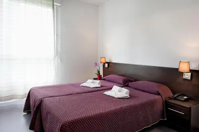 Un ou plusieurs lits dans un hébergement de l'établissement Residhotel Les Hauts d'Andilly