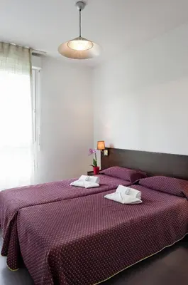 Un ou plusieurs lits dans un hébergement de l'établissement Residhotel Les Hauts d'Andilly