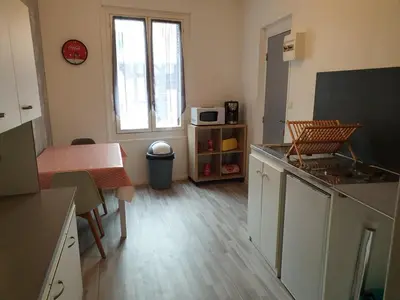 Cuisine ou kitchenette dans l'établissement appartement tiago