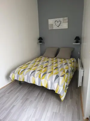 Un ou plusieurs lits dans un hébergement de l'établissement appartement tiago