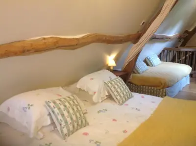 Un ou plusieurs lits dans un hébergement de l'établissement Le Clos-Masure de Béatrice