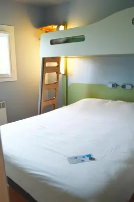 Un ou plusieurs lits dans un hébergement de l'établissement ibis budget Rouen Nord Isneauville