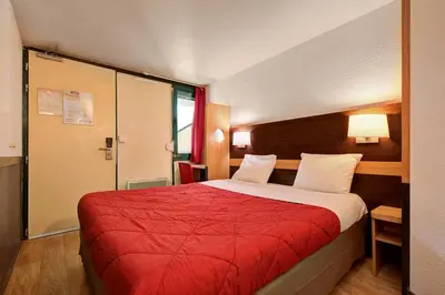 Un ou plusieurs lits dans un hébergement de l'établissement Premiere Classe Rouen Sud - Parc Des Expositions