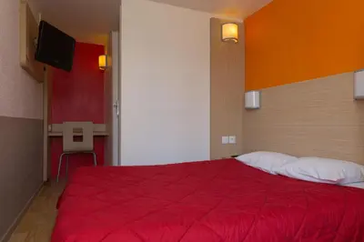 Un ou plusieurs lits dans un hébergement de l'établissement Premiere Classe Chantilly Sud Luzarches