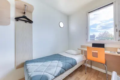 Un ou plusieurs lits dans un hébergement de l'établissement Premiere Classe Cergy Saint Christophe