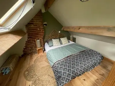 Un ou plusieurs lits dans un hébergement de l'établissement La maison du bonheur 
