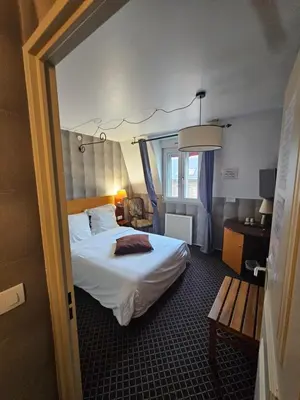 Un ou plusieurs lits dans un hébergement de l'établissement Hôtel 1er Consul Rouen