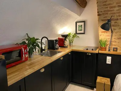 Cuisine ou kitchenette dans l'établissement Hôtel De La Cathédrale