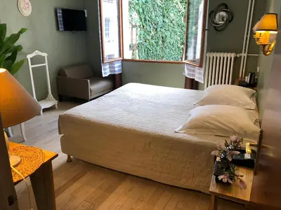 Un ou plusieurs lits dans un hébergement de l'établissement Hôtel De La Cathédrale