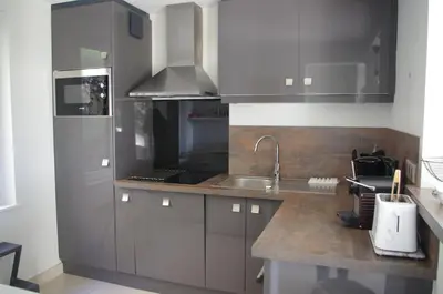 Cuisine ou kitchenette dans l'établissement La Bellevue, maison entière