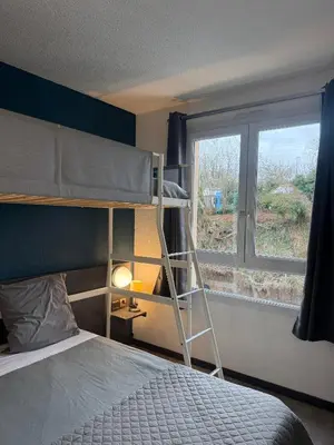 Un ou plusieurs lits dans un hébergement de l'établissement Hôtel La Nonette ASTERIX, CDG AIRPORT & PARIS CENTRE