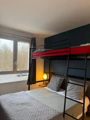 Un ou plusieurs lits dans un hébergement de l'établissement Hôtel La Nonette ASTERIX, CDG AIRPORT & PARIS CENTRE