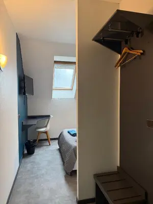 Un ou plusieurs lits dans un hébergement de l'établissement Hôtel La Nonette ASTERIX, CDG AIRPORT & PARIS CENTRE